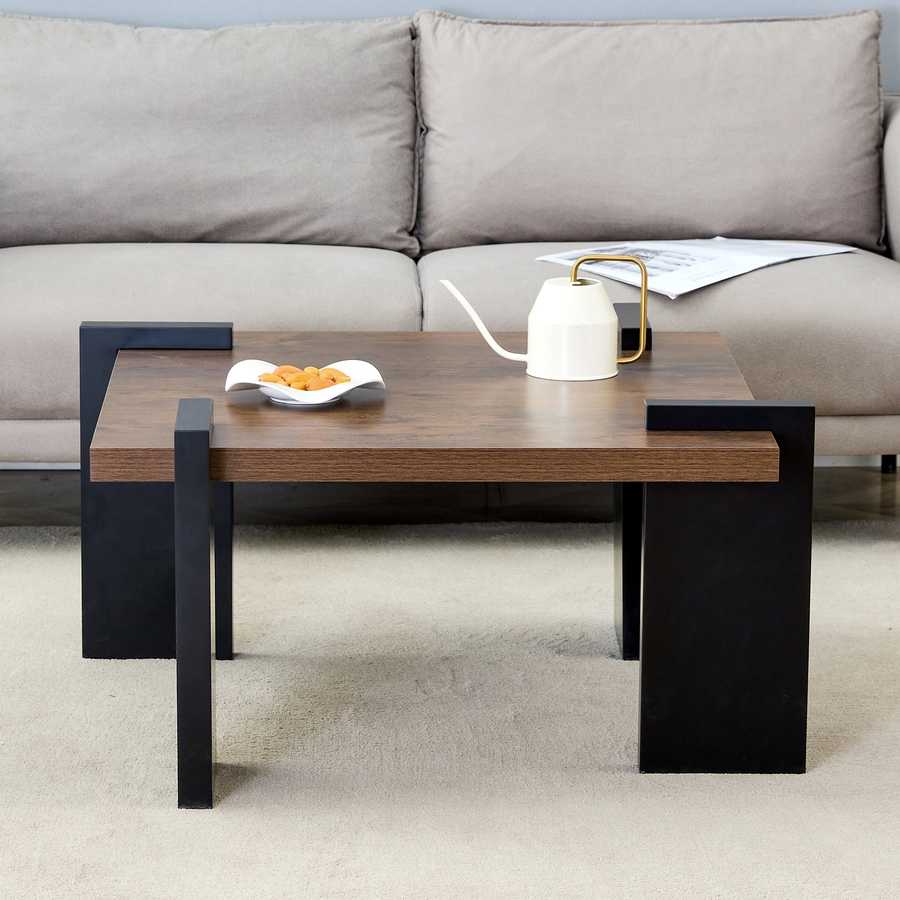 Modern Walnut Coffee Table - MDF Style in front of a sofa, emphasizing its bold black legs and rich walnut finish.