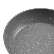 Close-up of interior speckled nonstick surface on aluminum frying pan from 3 piece skillet set.