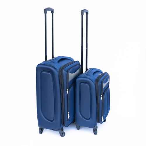 Blue suitcase with telescopic handle and four spinner wheels, positioned on a white background, ready for travel.