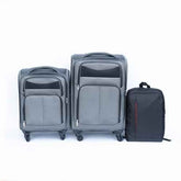 Set of gray suitcases and a backpack on a white background