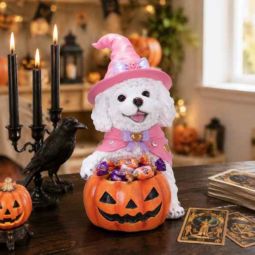 Cute white puppy figurine dressed as a witch with pink hat and cape, sitting in a carved pumpkin Halloween candy bowl, perfect for seasonal home decor.
