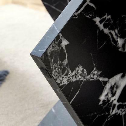 Corner joint of black MDF round coffee table with modern minimalism, showing precise construction and marble pattern detail.