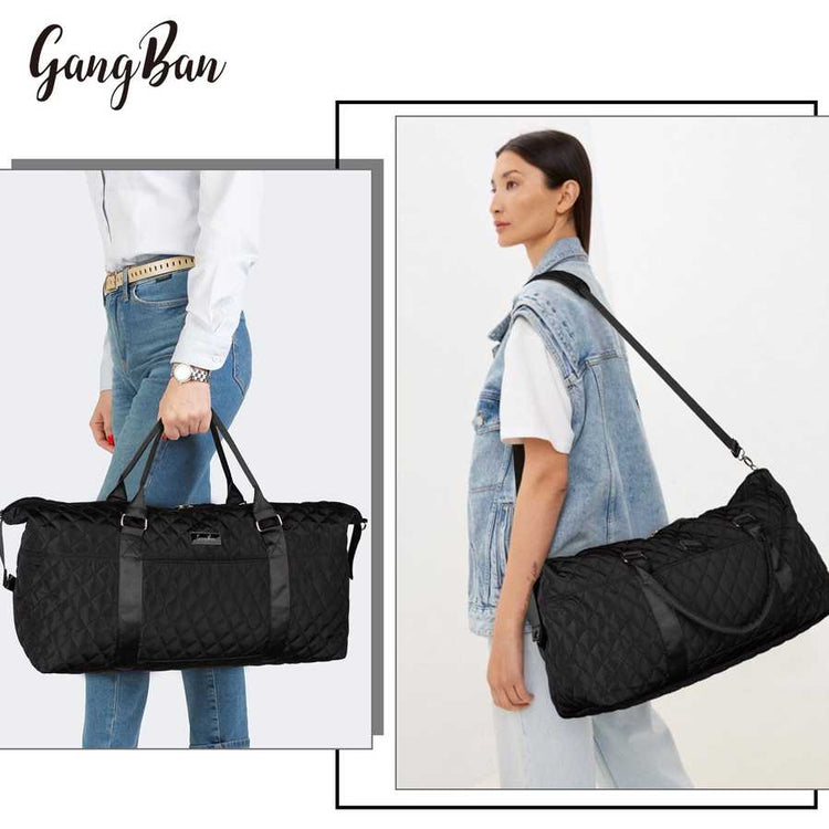 Black quilted duffel bag held by a person with &
