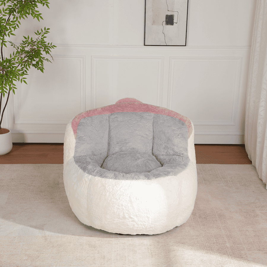 White and gray bean bag chair with pink accents on a light wooden floor.