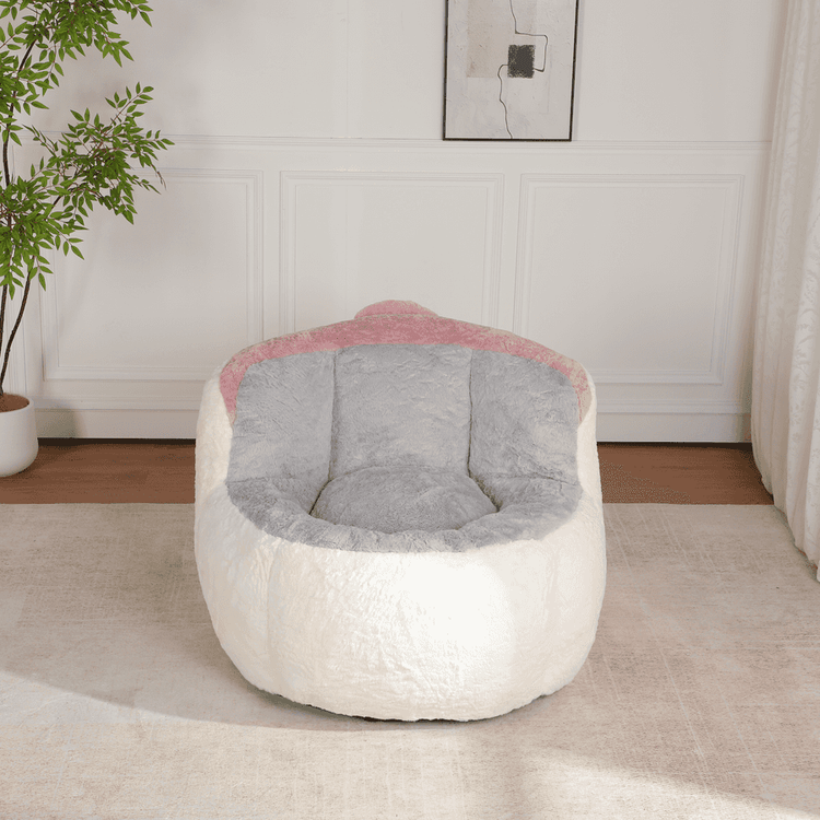White and gray bean bag chair with pink accents on a light wooden floor.
