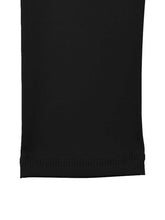 Close-up of MLNshops MT20 black yoga leggings hem, highlighting durable stitching and flexible fabric for activewear durability.