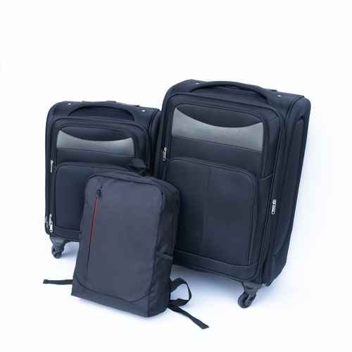 Set of black suitcases and a backpack on a white background