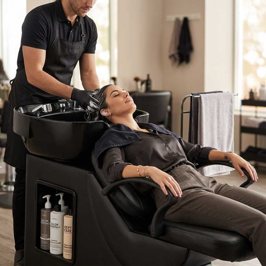 Salon shampoo bowl with deep ABS sink and black leather chair