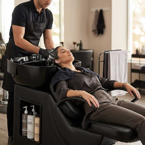 Salon shampoo bowl with deep ABS sink and black leather chair