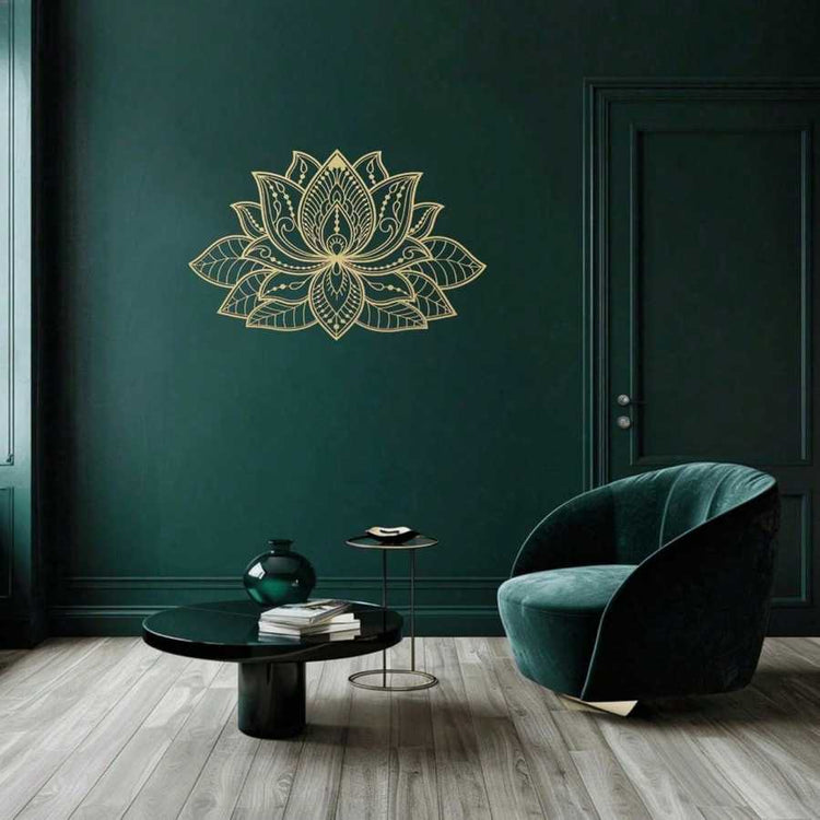Iron Mandala Wall Art in gold on a dark green wall above a velvet chair. Adds elegance and zen ambiance to modern interiors.