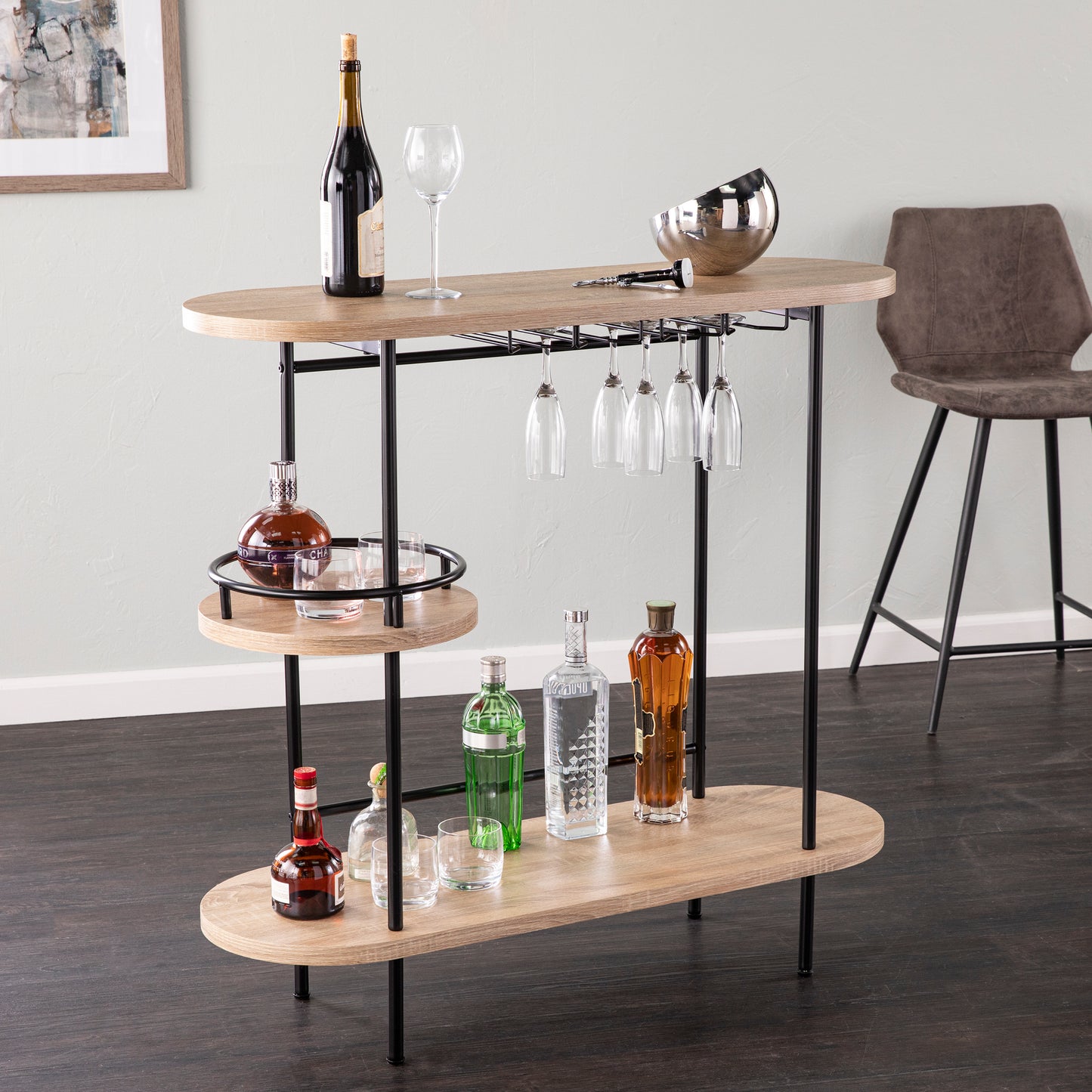 Dagney Wine Bar Table Storage in natural and black finish with glassware rack, three-tier shelving, and modern design for home bar setup.