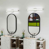 Bathroom with two vanity units and mirrors, featuring modern lighting fixtures.