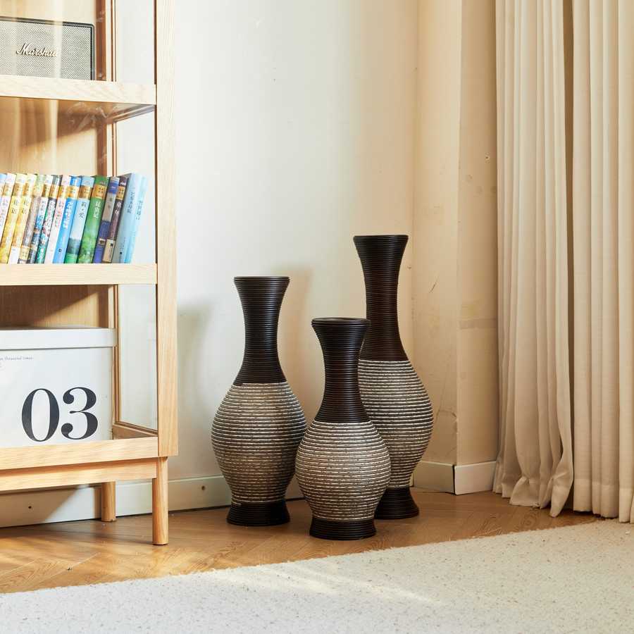 Brown floor vase set of 3 arranged near a curtain and bookshelf, perfect for adding a touch of sophistication to home décor.