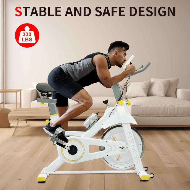 Person using a stationary bike in a living room with text about stable and safe design and weight capacity.