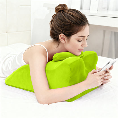 Woman lying on stomach using Ergonomic Spinal Posture Support Pillow - Memory Foam for chest and neck support while browsing phone.
