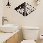 Metal celestial wall art with mountain, moon, sun, and star design for modern home decor