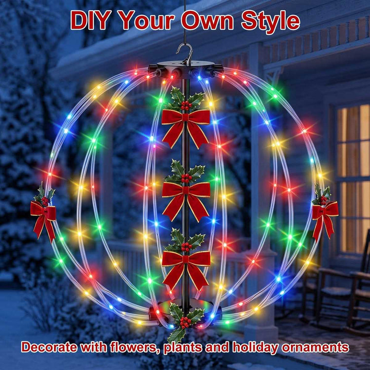 LED ball light decorated with red bows and holly