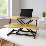 Laptop on 32 inch desk converter with adjustable height, ideal for ergonomic workstations in home or office environments.
