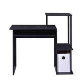 Close-up of black wood and metal computer desk with multiple surfaces and storage