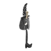Side view of a black gnome Halloween figure with a tall polka dot hat, long striped legs, and cozy outfit, perfect for holiday decoration.