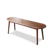 A modern wooden bench with an elongated oval-shaped seat and tapered legs, shown on a clean white background.