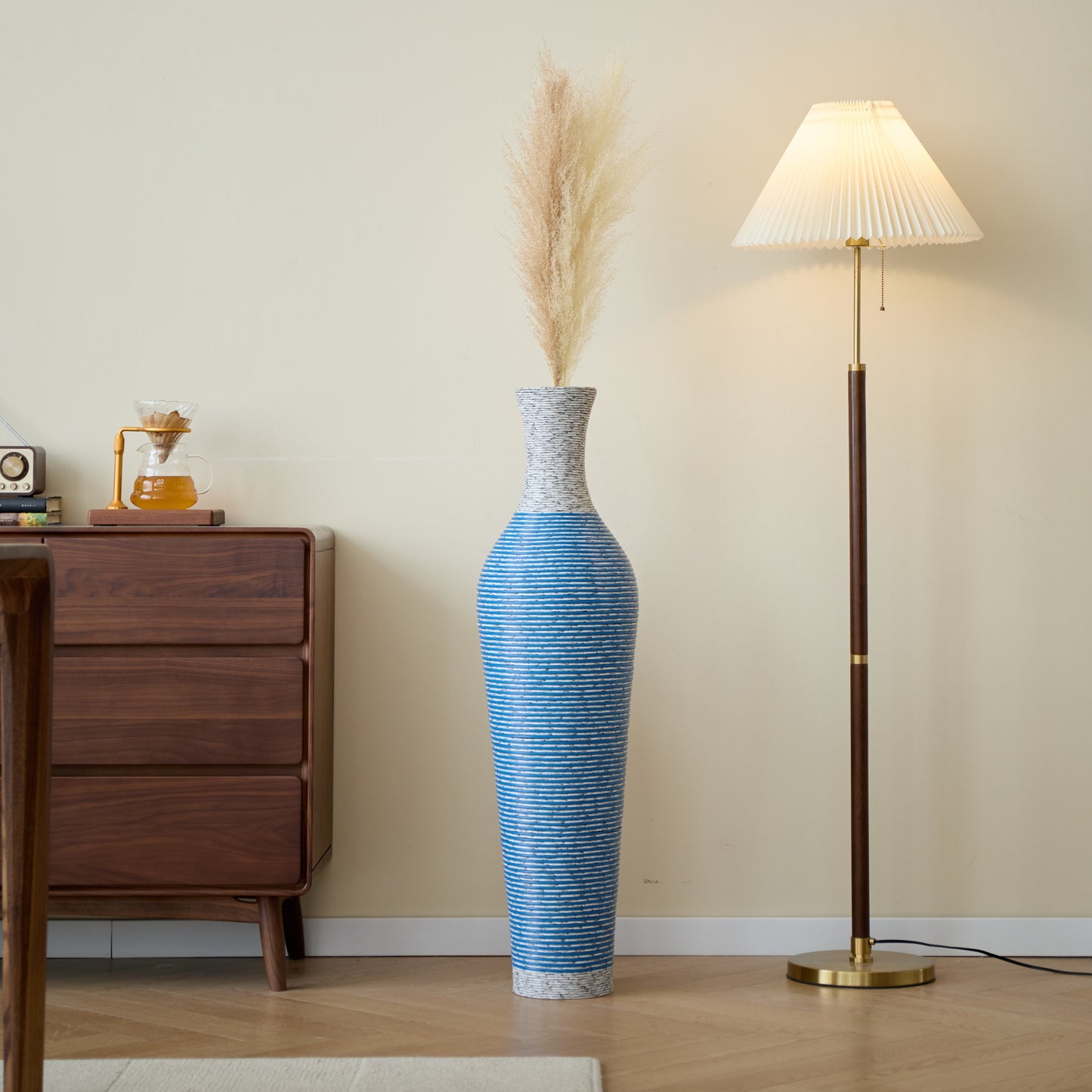 39-inch floor vase decor with pampas grass beside a floor lamp, enhancing the cozy ambiance of a modern living space.