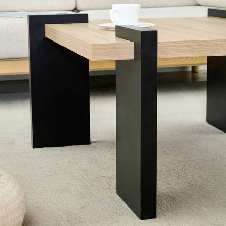 Side view of MDF Coffee Table with black legs and wood top, emphasizing its modern aesthetic and clean design lines.