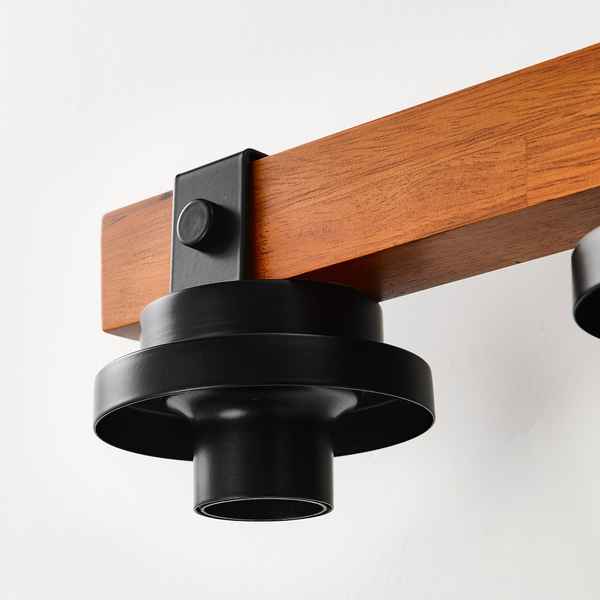 Wooden shelf with black metal bracket on a white background