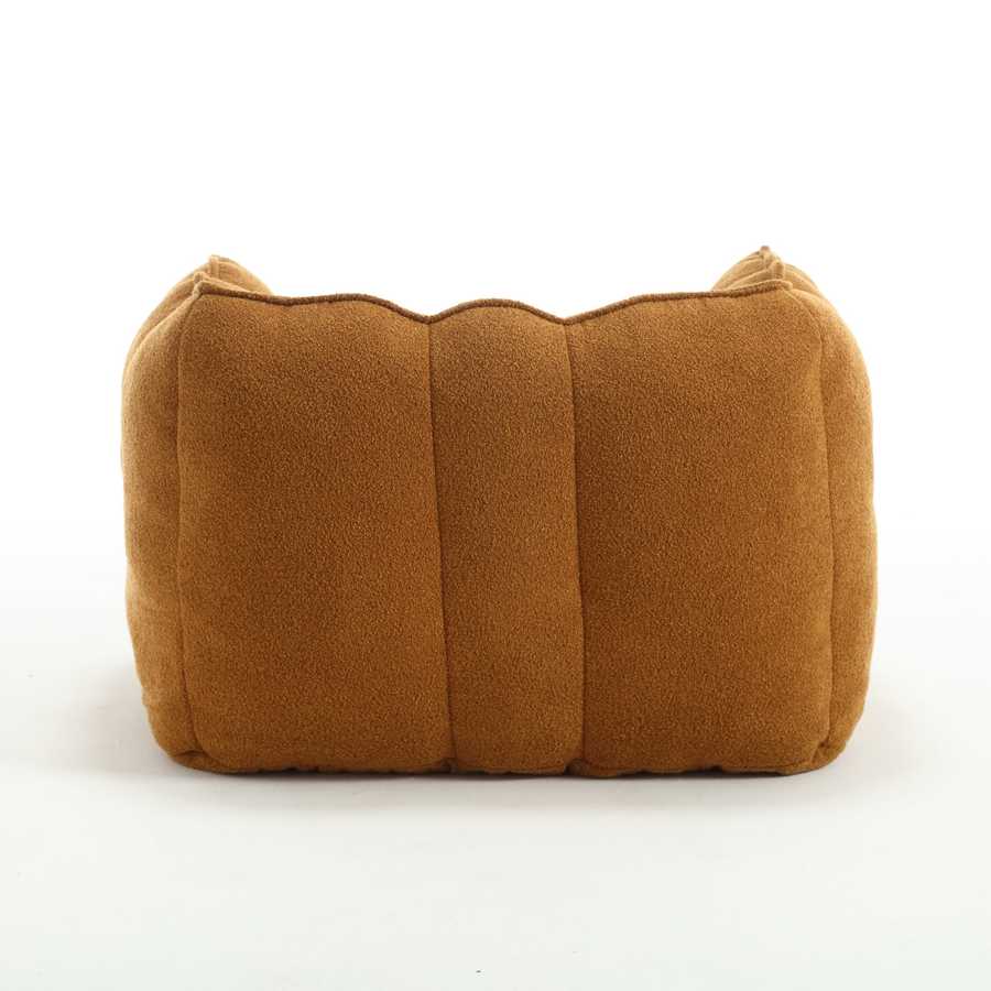 Brown cushion with a textured surface on a white background