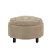 Round beige ottoman with tufted top on a white background