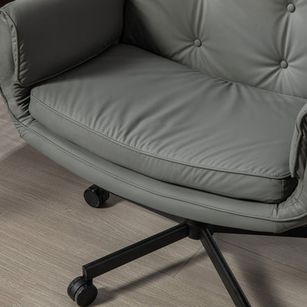Gray office chair with wheels on a wooden floor