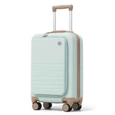 A hard-shell spinner suitcase in a pale mint green color with tan accents on the handle, zipper trim, and wheels, shown on a clean white background.