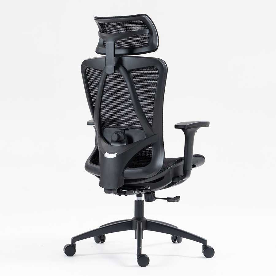 Rear angled view of ergonomic high back mesh office chair with adjustable headrest and lumbar support knob for personalized comfort.
