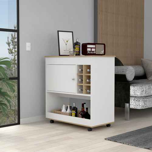 A white and light wood bar cart with a cabinet door, wine bottle rack, and open shelf, shown in a modern living room setting next to a sofa.