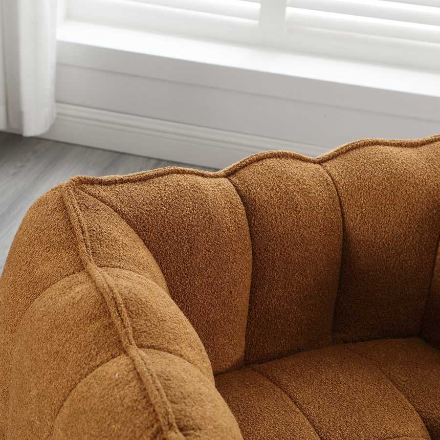 Brown textured sofa corner with a neutral background