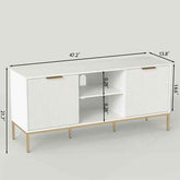 Living room with white modern TV stand featuring ribbed doors, gold handles, and decorative vases on top