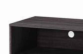 Close-up of dark wood grain finish on the Amidon TV stand with a circular cable hole for cable management