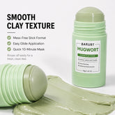 A light green clay stick mask shown on a clean white background, with one end lying down to reveal the textured clay stick and a smear of the mask in front. Text on the left reads &