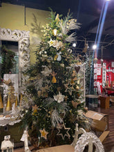 Snowflake hanging ornament on a decorated Christmas tree