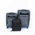Set of gray suitcases and a black backpack on a white background