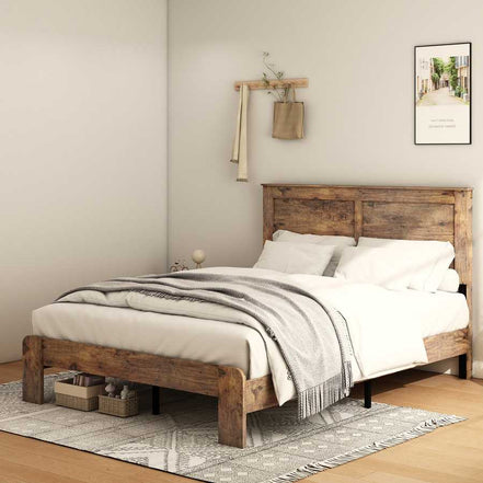 Angled view of full size wood platform bed frame with sturdy legs and under-bed storage, styled with neutral bedding and decor.