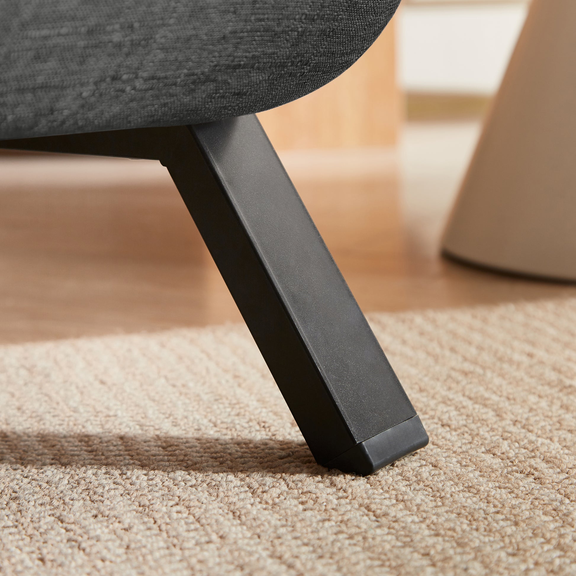 Close-up of the sturdy black metal leg on the Convertible Sofa Bed Chair, showcasing durable support and sleek design for folding chair beds.