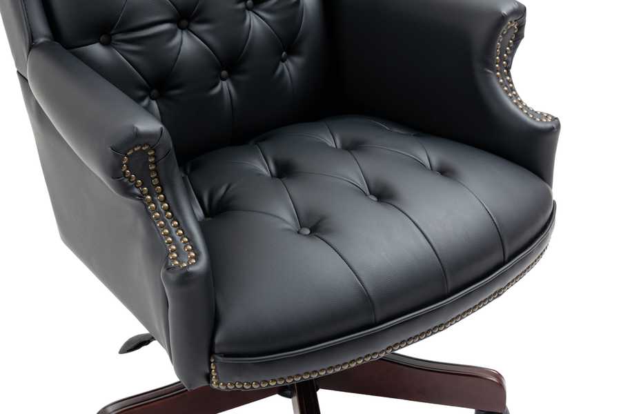 Black leather office chair with tufted design on a white background
