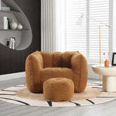 Brown armchair and ottoman on a patterned rug in a modern living room.