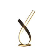 Modern gold and black table lamp on a white background