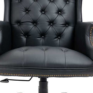 Black leather armchair with tufted backrest and decorative nailhead trim on a white background