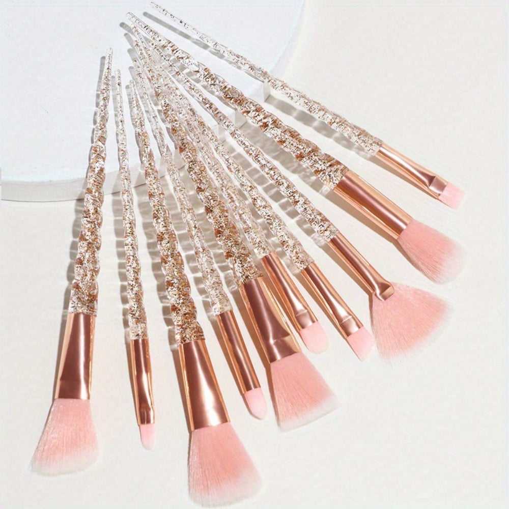 Flat lay of Pink Crystal Makeup Brush Set with transparent glitter handles and soft pink bristles for flawless makeup blending.