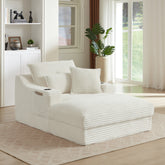 White modular sofa in a modern living room with plants and a large window.