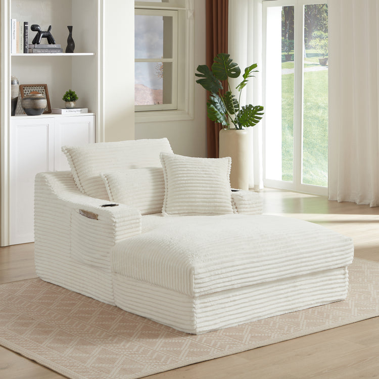 White modular sofa in a modern living room with plants and a large window.