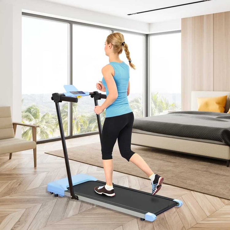Woman walking on treadmill with LED display in living room